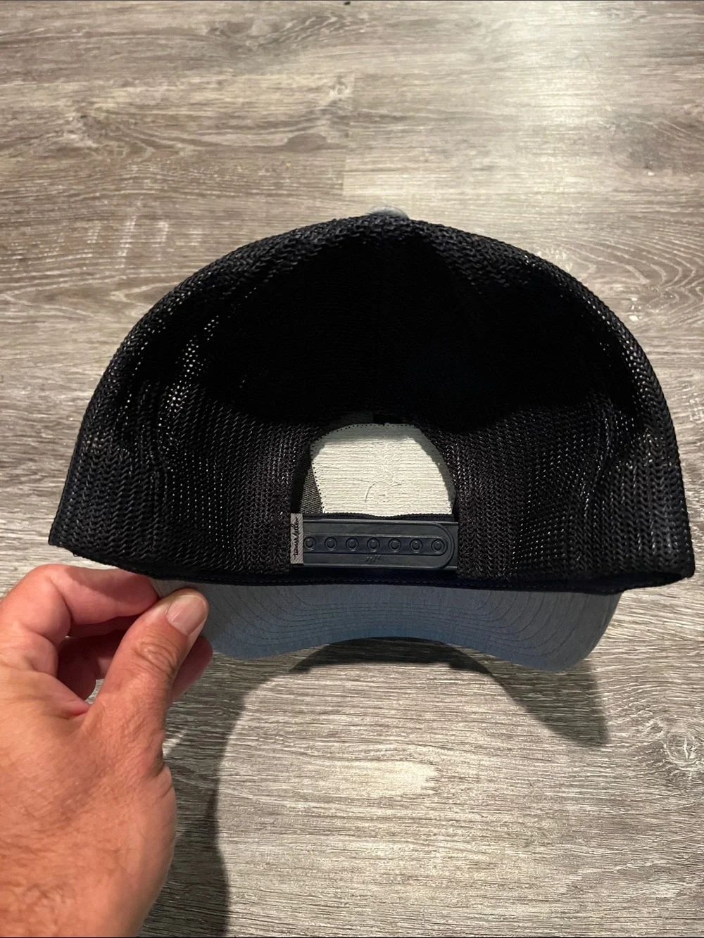Travis Mathew Gray and Black Bushwood Champion Trucker Hat